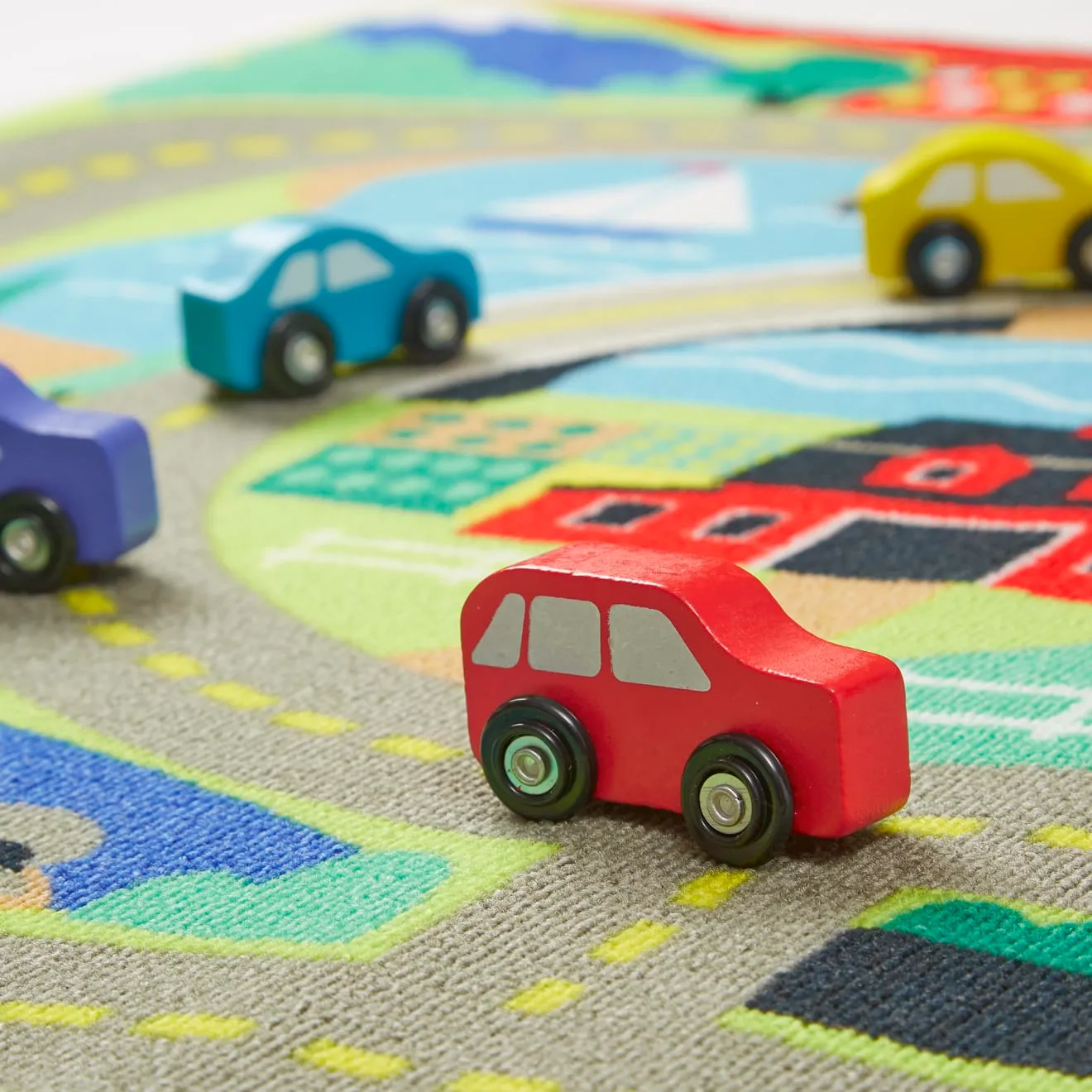 Melissa & Doug Round the Town Spielteppich mit 4 Autos