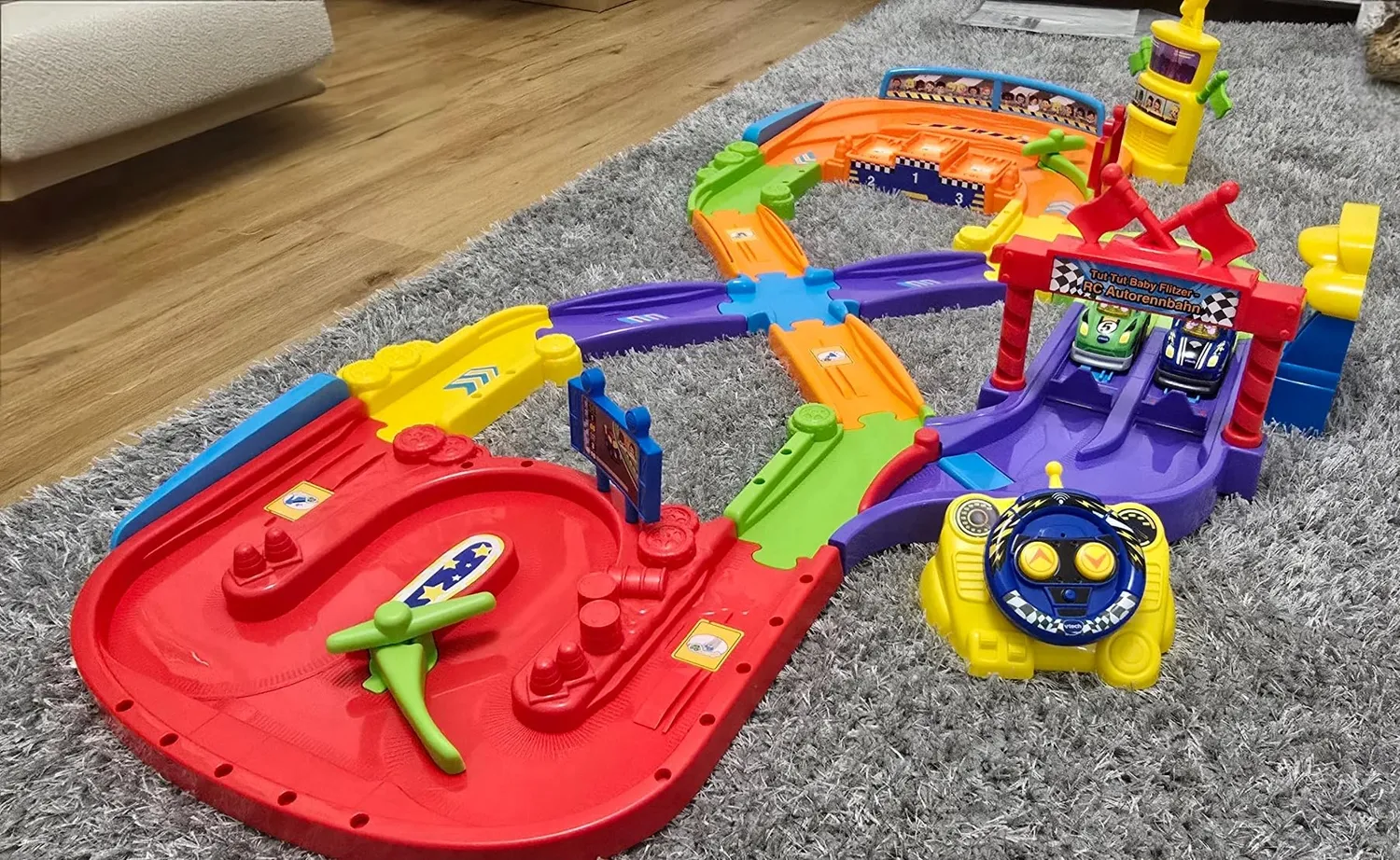 VTech Tut Tut Baby Flitzer RC Autorennbahn Spielset mit Fernbedienung
