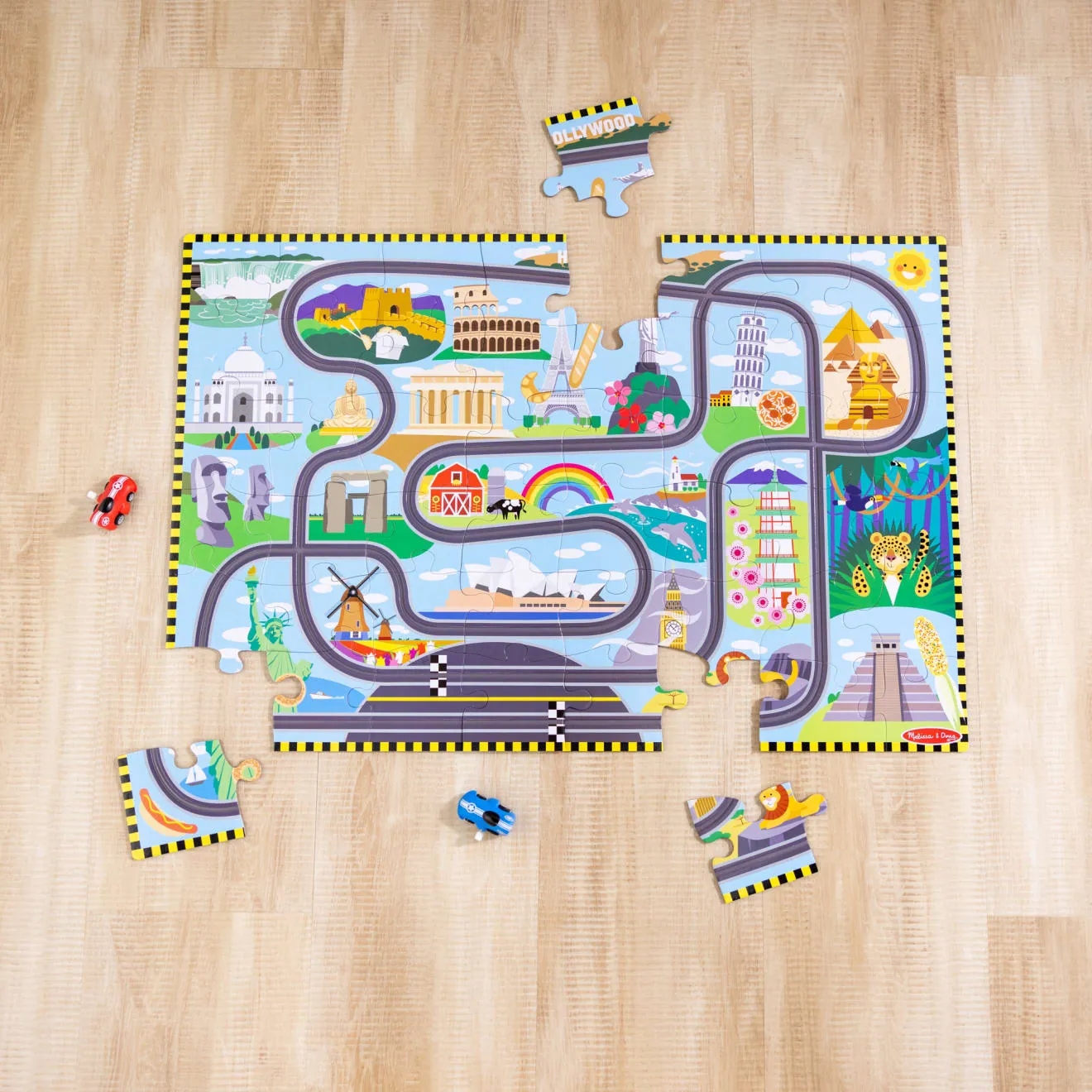 Melissa & Doug Race Around the World Bodenpuzzle 48 Teile Rennbahn