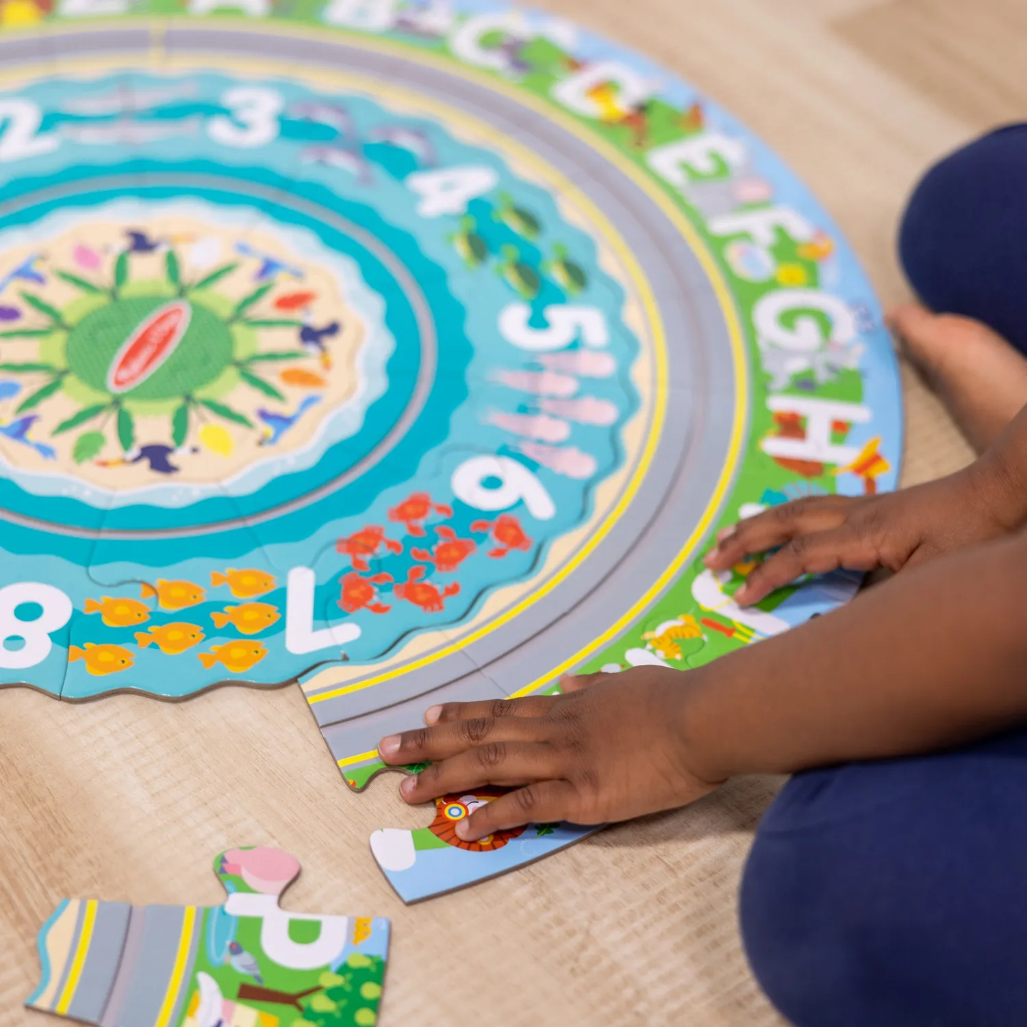 Melissa & Doug Round the Shore Tracks Bodenpuzzle 48 Teile rund